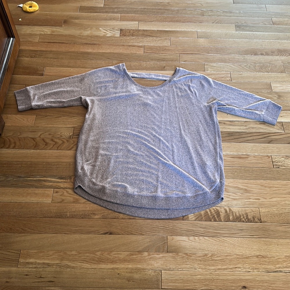 Maurice’s mauve light sweeter with open upper back area. Size is XXL